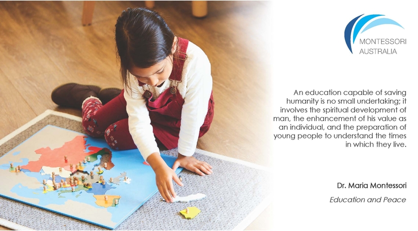 Primary aged girl on floor carpet with Montessori map material