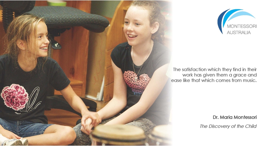 Two children smiling in music class