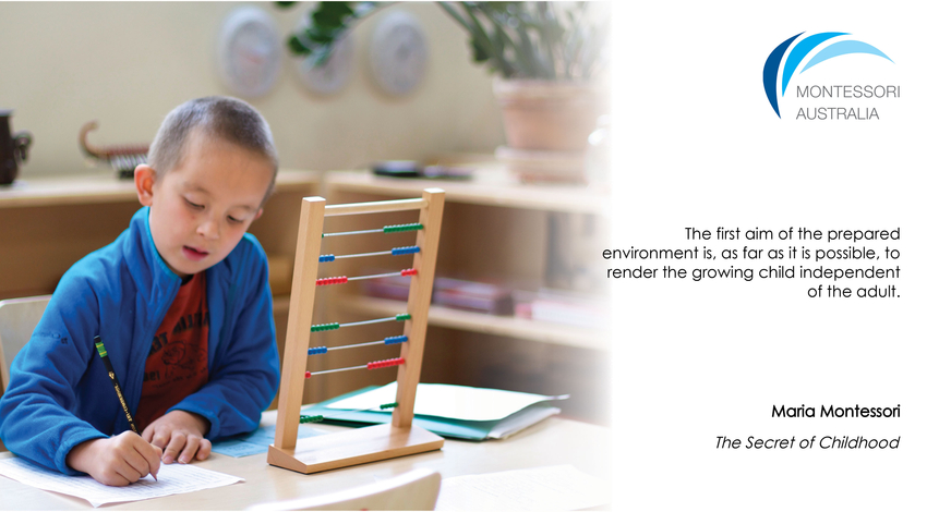Boy in Montessori classroom using abacus material