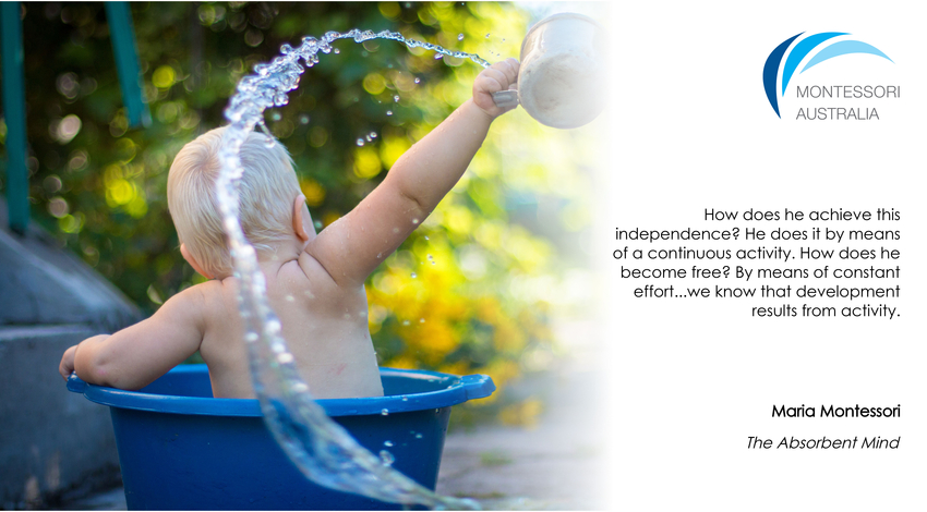 Baby outdoors in bucket bath splashing water