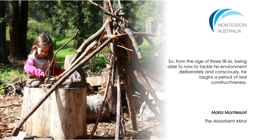 Child outdoors making structure with sticks